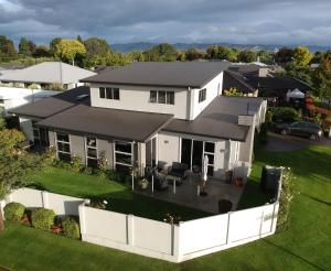 an aerial view of a white house with a yard at Nottinghill B n B in Blenheim