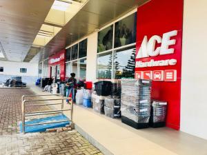 a man is standing in front of a store at Wind Suites Tagaytay at SMDC in Tagaytay