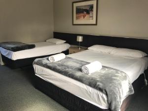 Postel nebo postele na pokoji v ubytování Motel 80