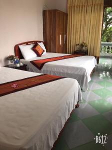 Uma cama ou camas num quarto em Tam Coc - Thành Homestay