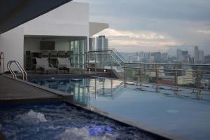a swimming pool on the top of a building at One Central Hotel & Suites - Multiple Use Hotel in Cebu City