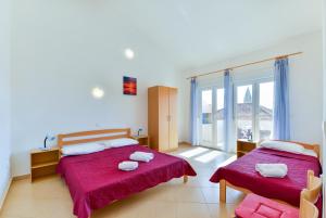 Postel nebo postele na pokoji v ubytování Apartments Lavanda