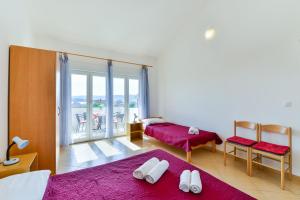 Postel nebo postele na pokoji v ubytování Apartments Lavanda