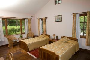 Ένα ή περισσότερα κρεβάτια σε δωμάτιο στο The Begnas Lake Resort & Villas