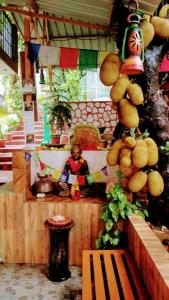 a room with a person sitting on a bench at Hill Top Swiss Cottage in Rishīkesh