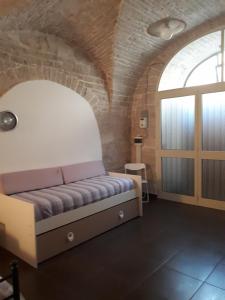 A bed or beds in a room at La Casa In Fiore