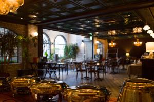 a row of drums in a room with tables and chairs at 9 Brick Hotel in Seoul