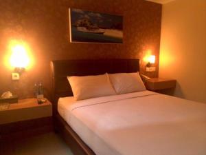 Giường trong phòng chung tại Antoni Hotel