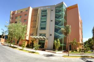 a building on the side of a street at Hostalia Hotel Expo & Business Class in Guadalajara