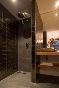a bathroom with a shower and a sink at Ververs slapen in Den Bosch