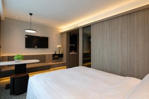 Uma cama ou camas num quarto em Nathan Hotel