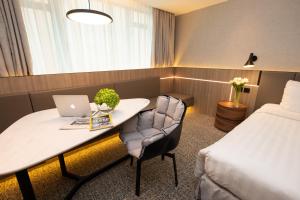 Uma cama ou camas num quarto em Nathan Hotel