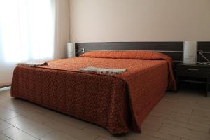 Postel nebo postele na pokoji v ubytování Hotel Residence Aurora