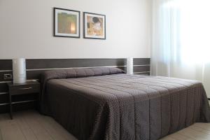 Postel nebo postele na pokoji v ubytování Hotel Residence Aurora