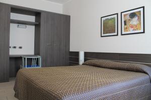 Postel nebo postele na pokoji v ubytování Hotel Residence Aurora