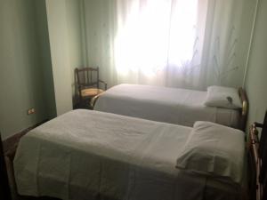 Ένα ή περισσότερα κρεβάτια σε δωμάτιο στο Casa Nicolangelo