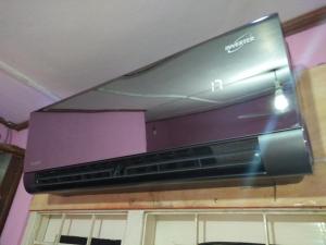 a flat screen tv hanging from a ceiling at Manjula Luxury AC Apartments in Negombo +21 photos
