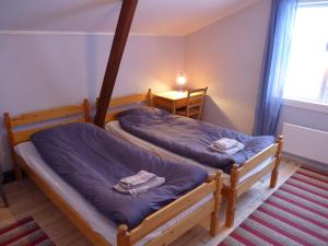 Cama o camas de una habitación en Uppe på Vinden