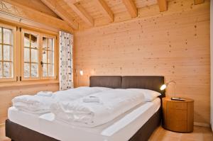 Säng eller sängar i ett rum på Apartment Bärgrose - GRIWA RENT AG