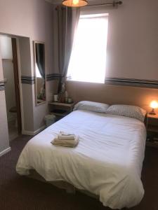 Ένα ή περισσότερα κρεβάτια σε δωμάτιο στο West Vale Villa