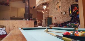 a billiard room with a pool table and balls at Bastide Napoléon in Séranon