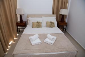 Postel nebo postele na pokoji v ubytování Lagada Resort