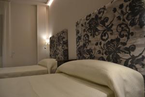 a hotel room with a bed and a chair at Hotel Español in La Pueblanueva +31 photos