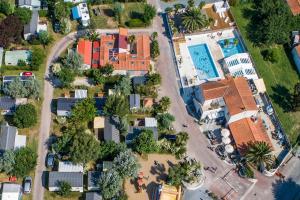 an overhead view of a house with a pool at Camping Antioche D'Oléron in La Brée-les-Bains