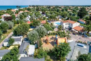 an aerial view of a small town with a playground at Camping Antioche D'Oléron in La Brée-les-Bains