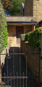 a fence in front of a house with a door at North Street annexe in Ilminster
