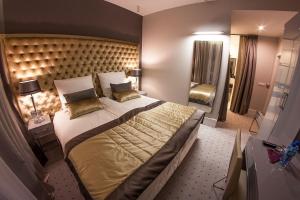 Кровать или кровати в номере NovaWisła Resort & SPA