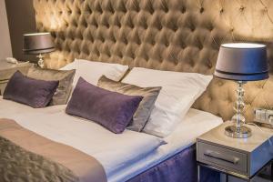 Кровать или кровати в номере NovaWisła Resort & SPA