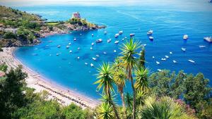 an aerial view of a beach with boats in the water at Villa Crawford in San Nicola Arcella
