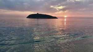a small island in the middle of the ocean at Villa Crawford in San Nicola Arcella