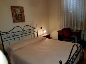 Postel nebo postele na pokoji v ubytování Hotel Scalinatella