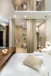Onyx luxury apartments tesisinde bir odada yatak veya yataklar