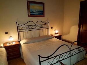 Postel nebo postele na pokoji v ubytování Hotel Scalinatella