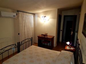 Postel nebo postele na pokoji v ubytování Hotel Scalinatella