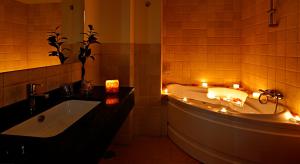 a bathroom with a tub and a sink with lights at Casa del Trigo in Santa Fe +53 photos