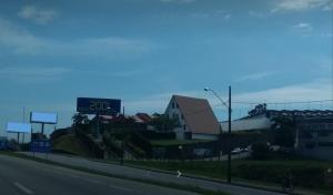a highway with a sign on the side of a building at Motel 2001 (Adults Only) in São José