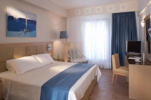 Voodi või voodid majutusasutuse Lagos Mare Hotel toas