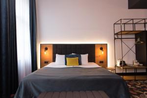 Postel nebo postele na pokoji v ubytování Hotel Rum Budapest
