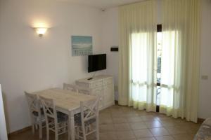 TV a/nebo společenská místnost v ubytování Residence Porto Mannu