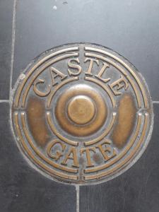 a metal manhole cover with the words australian gate at Castle Gate House Derry City Centre Townhouse STILL OPEN in Derry Londonderry