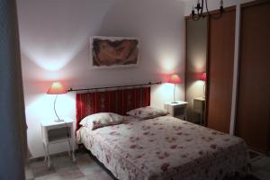 Ένα ή περισσότερα κρεβάτια σε δωμάτιο στο Appartement Avec Patio Et Garage Centre Ville Et Plage