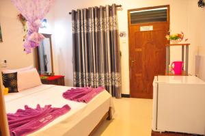 Postel nebo postele na pokoji v ubytování Sigiri Saman Home Stay