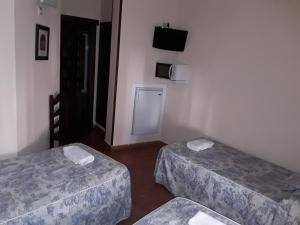 Ein Bett oder Betten in einem Zimmer der Unterkunft Hostal Rocio