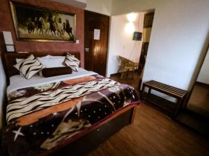 Giường trong phòng chung tại Nuwara Eliya Hills Rest