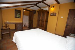Postel nebo postele na pokoji v ubytování Hotel Posada San Antonio