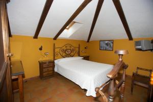 Postel nebo postele na pokoji v ubytování Hotel Posada San Antonio